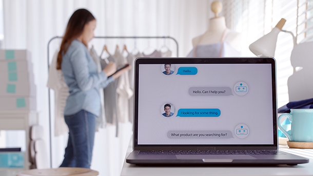 Chatbot conversation on laptop screen app interface with artific